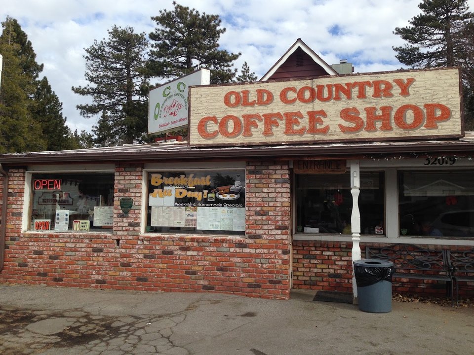Cozy diner tables with counter seating nearby.