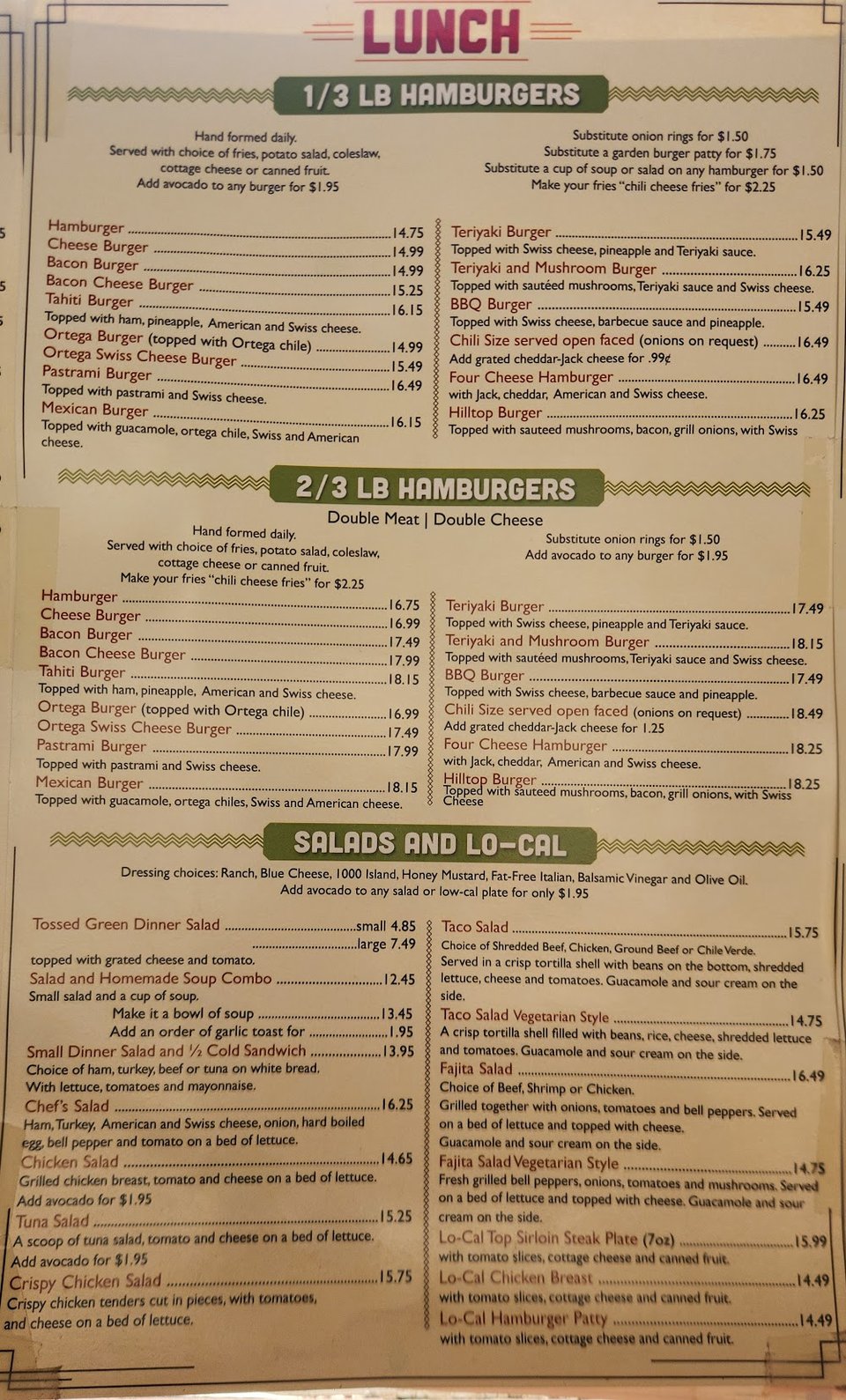 Printed menu with burgers, salads, and waffles.
